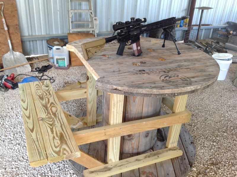 Shooting bench made out of big wooden spools